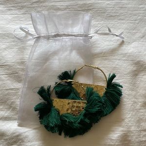 Gold earrings with green fringe